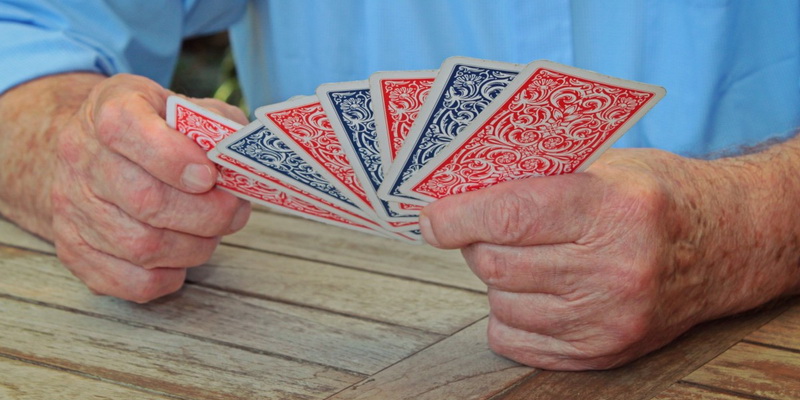 Playing cards in human hands